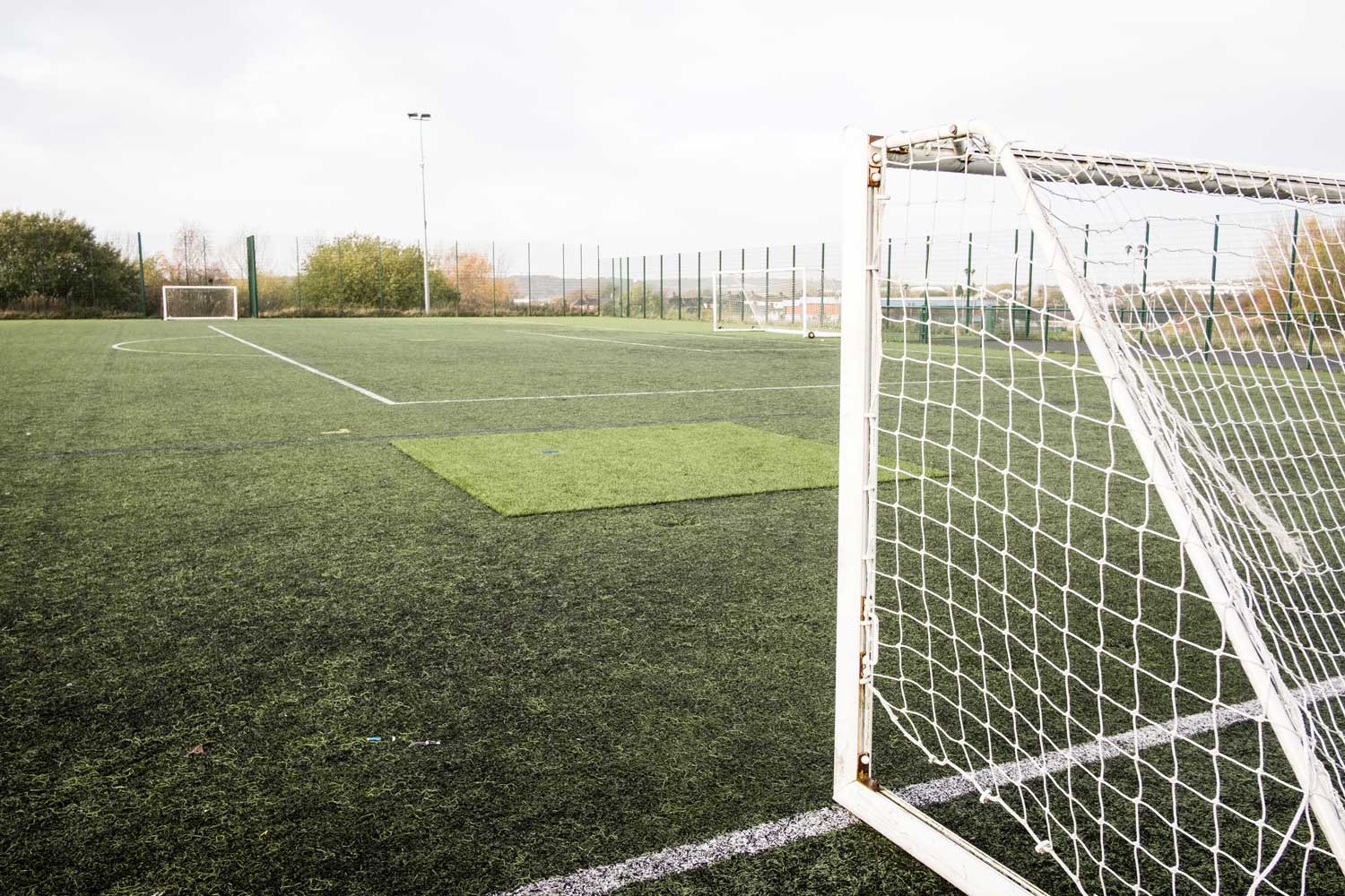 image of goal posts on outdoor fottball pitch