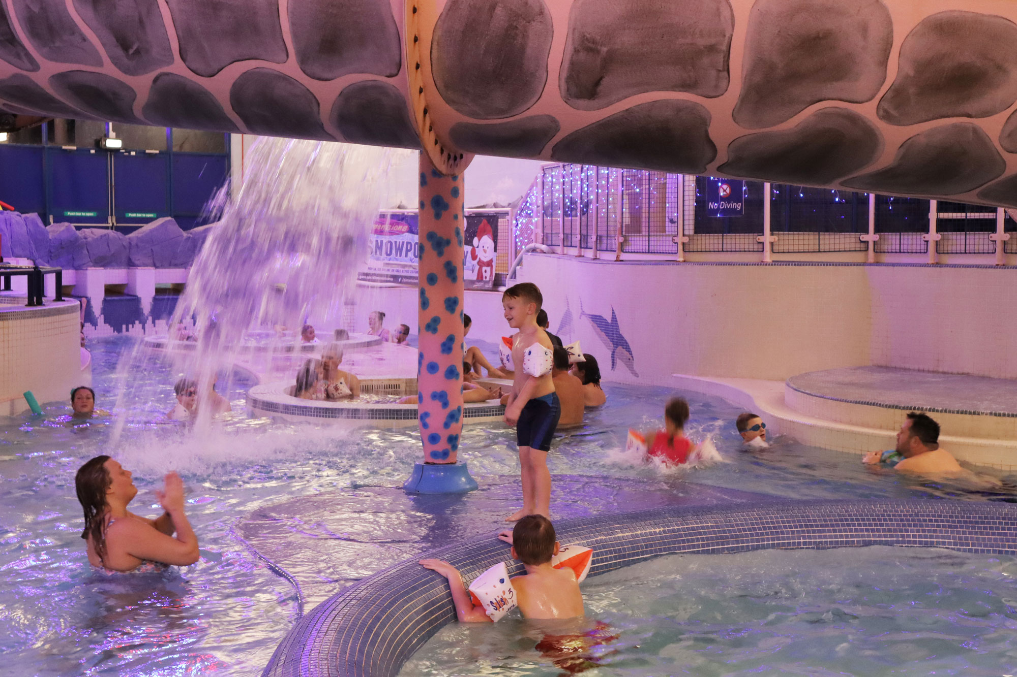 People swimming in dimensions f\ntasy pool